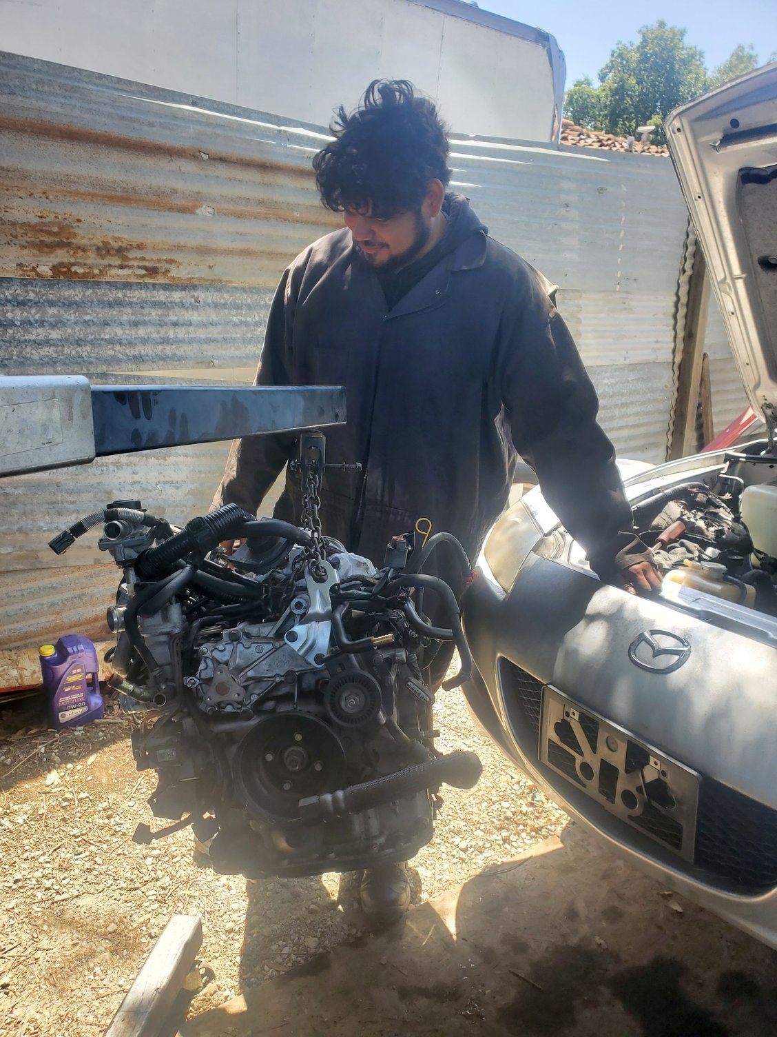 Sebastian and his first car, 2006 RX-8.