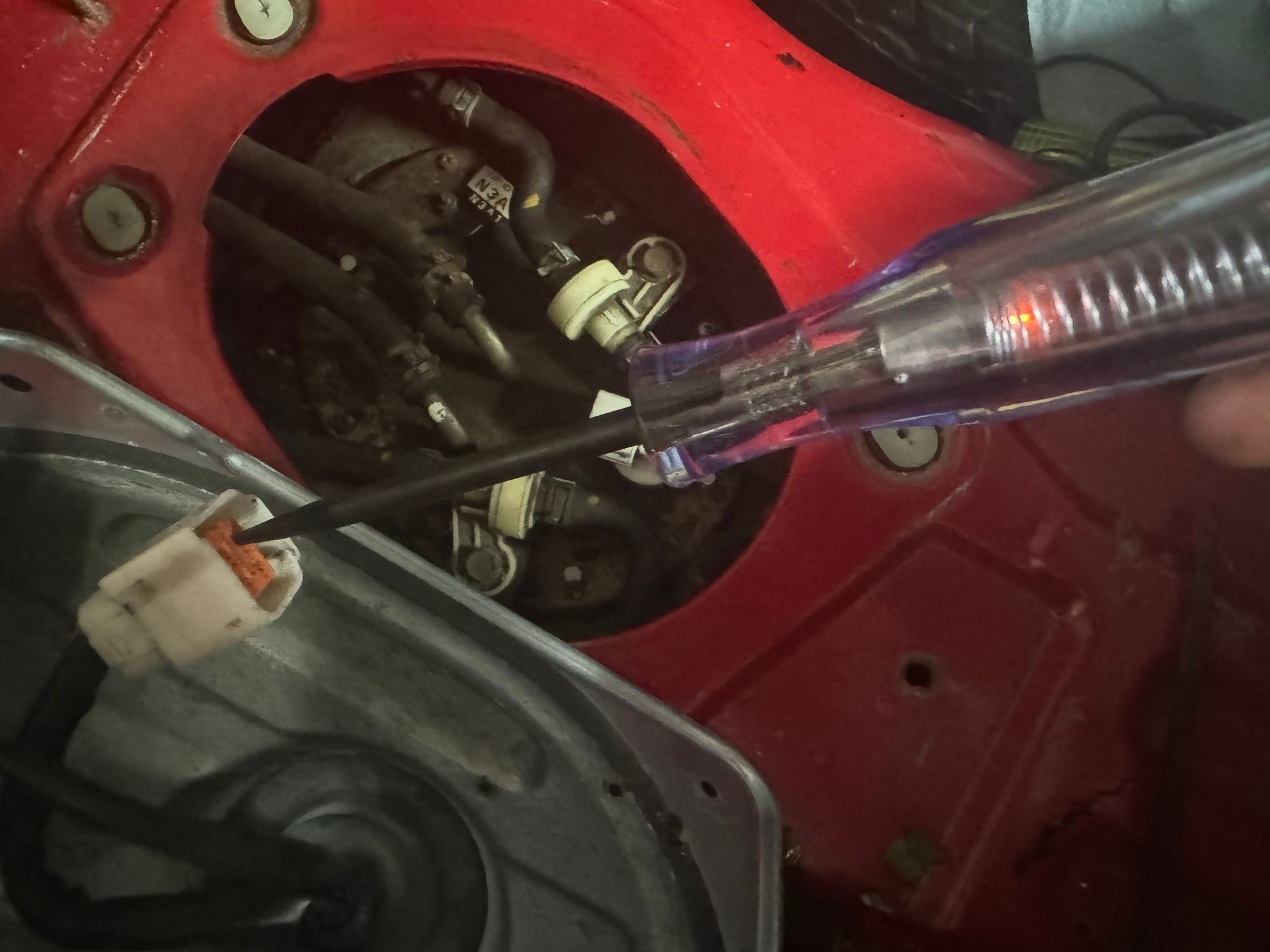 The test light shows that the fuel pump connector is receiving lower voltage than expected. Instead of a bright light, it glows dimly, indicating a possible voltage drop in the circuit. I�ve already replaced the EGI 30A fuse and swapped the fuel pump relay, but the issue persists. I suspect there may be a problem with the MAIN 120A fuse or a weak ground connection. Any suggestions on what else to check?