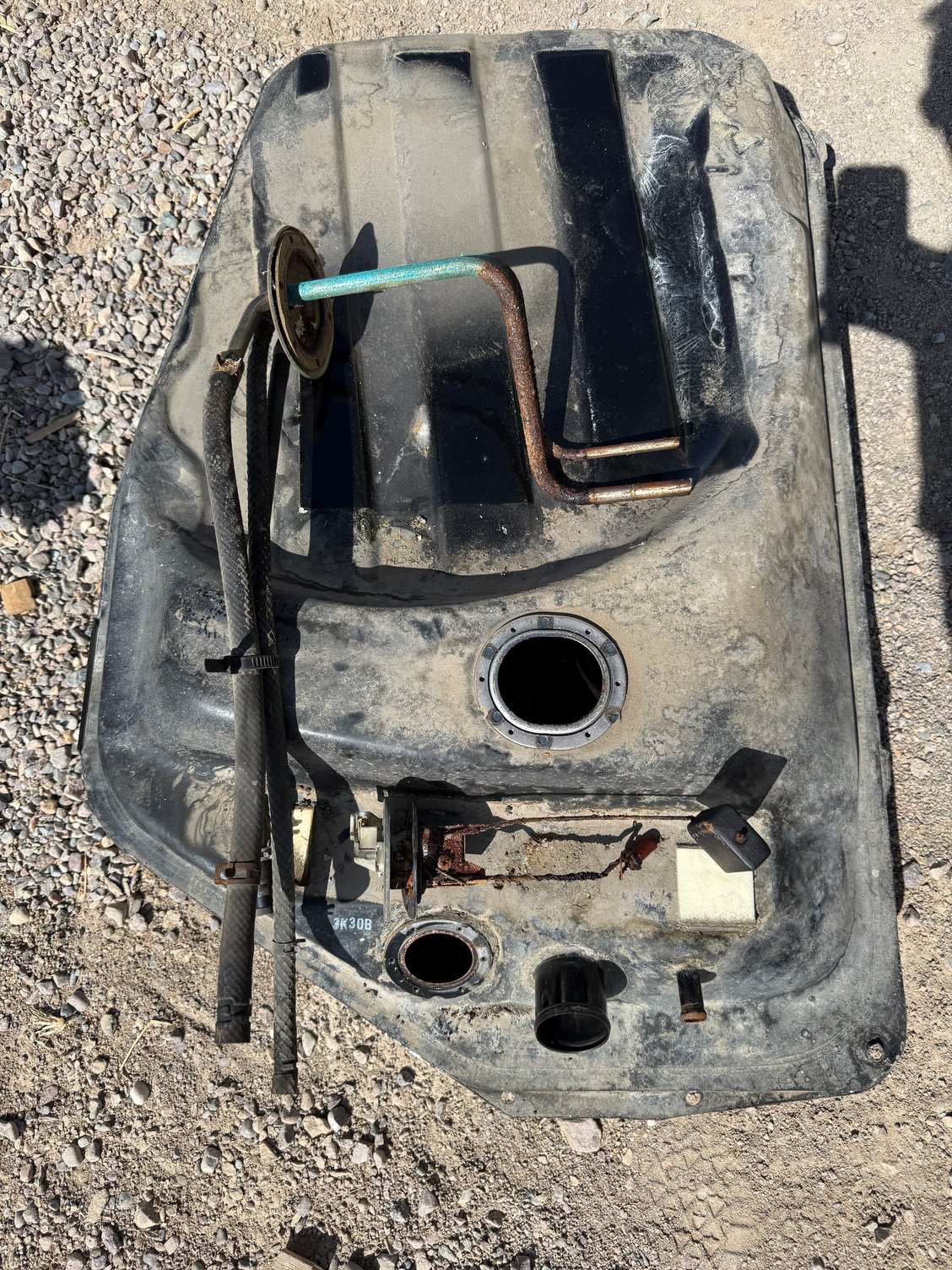 Tank out, rusty parts.