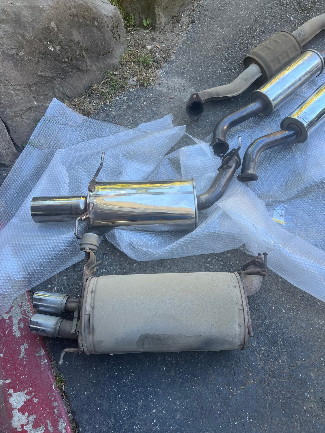 Stock muffler and autoexe. Notice the stock exhaust has boost activated valving. Way back from 1990. 