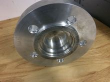 The tricky part was this wheel spacer . The inner part centres to the rx7 hub. The outer ring centers the Porsche rotor which has a large center hole. The other side of this spacer has a raised center to center the wheel . 3.25 inch long arp wheel studs were required as well.