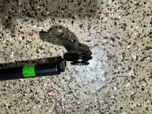 Close up view of the gas strut bottom brackets after removal