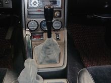 Certainly not OEM looking, but the black powdercoat makes it as subtle as it can be.  I think fits well with the Alcantara shift boot.  