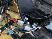 This is the current state of the harness. It coils up under the radio, taking up the blank spot