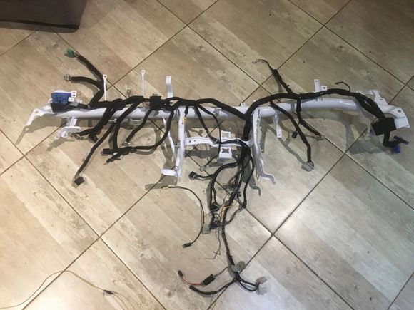 After 

Took about 4 hours to remove the tape and replace it 
I ran out of the felt material at the end . So will have to finish it tomorrow . Still need to redo the radio harness connectors properly and sand down the earth points so they make propper contact . So happy with the result so far ;) 