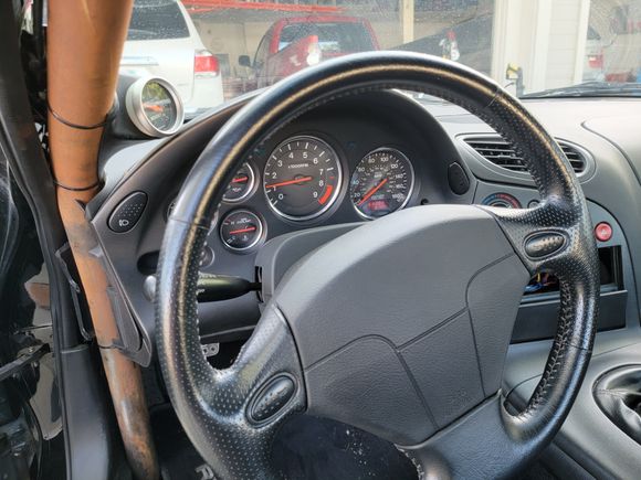 Big ol' OEM steering wheel, that needs to be changed...