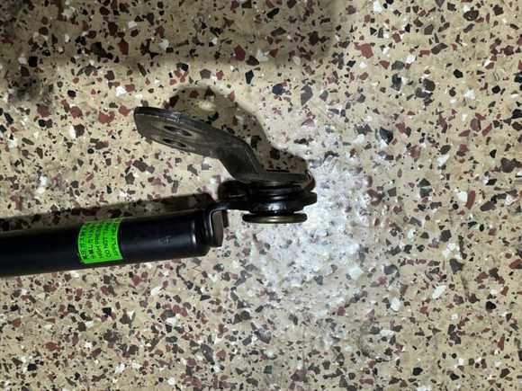 Close up view of the gas strut bottom brackets after removal