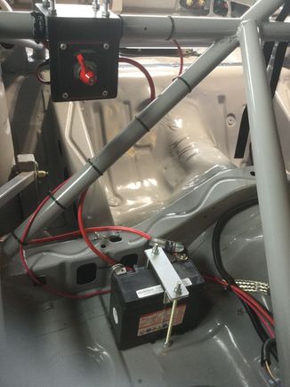 200A motorcycle battery. You can make out the upper support for the 4-link rear arms. 