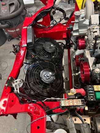 Radiator fans were replaced with new dual flex-a-lite s-type fans. New mishimoto radiator  with all new coolant lines throughout the engine bay. 