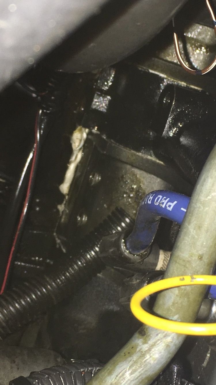 Oil leak around oil filler neck to center plate Mazda