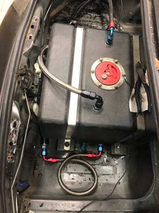 Fuel pump, and filters are plumbed in back.  Need to do breather setup still.  This will be replaced with a bladder style set in flush with the trunk at a later time.