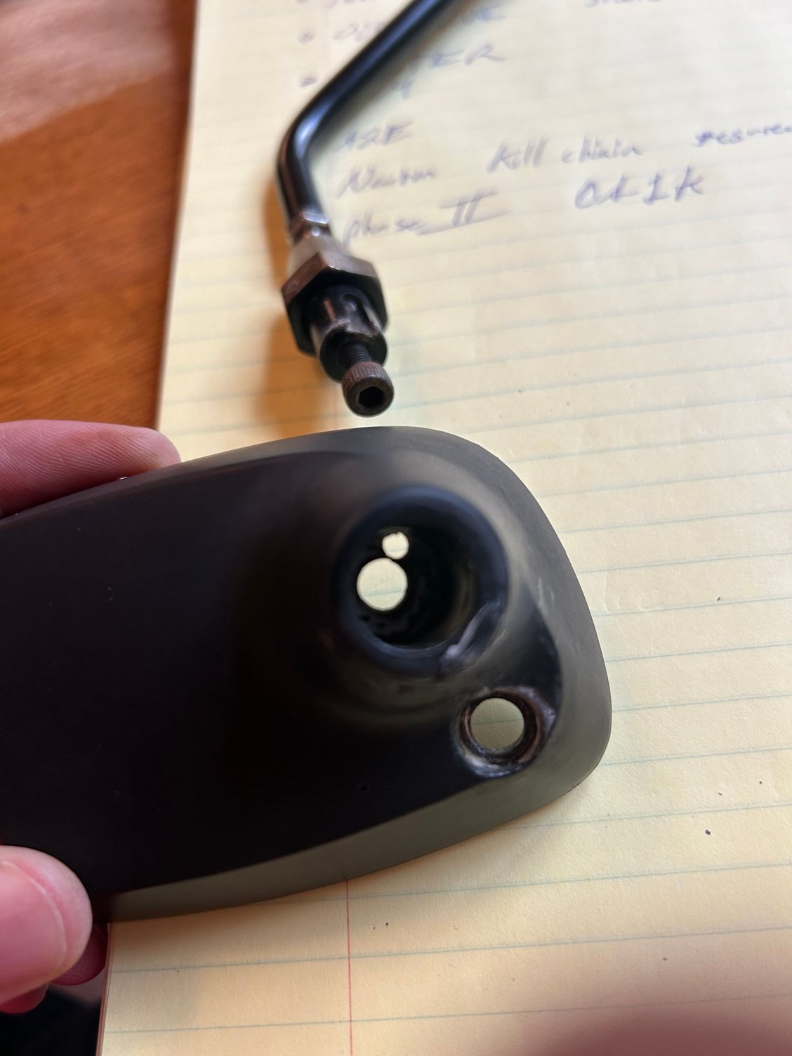 You can see how it works, pin keeps the mirror arm from spinning/rotating on the base. 