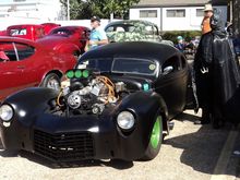 When you REALLY want attention, paint your rims green. Oh, yeah. And dress up as a super hero. That black outfit had to be getting pretty warm by 2 PM with a high of 85 and sunny skies.