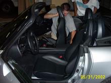 Neil puts the last seat in