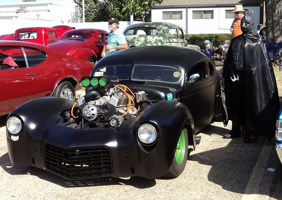When you REALLY want attention, paint your rims green. Oh, yeah. And dress up as a super hero. That black outfit had to be getting pretty warm by 2 PM with a high of 85 and sunny skies.