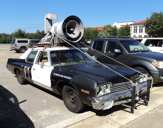 "It's got a cop motor, a 440 cubic inch plant, it's got cop tires, cop suspensions, cop shocks. It's a model made before catalytic converters so it'll run good on regular gas. What do you say, is it the new Bluesmobile or what?"