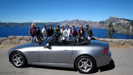 e the girls fawning over garrets car.jpg