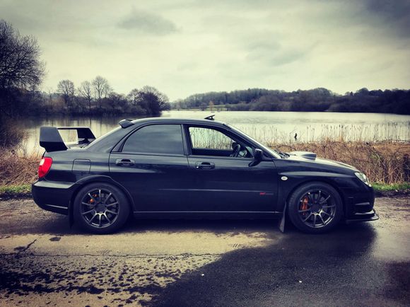 I prefer the clean side lines, now it just looks like any other normal STi IMO 
