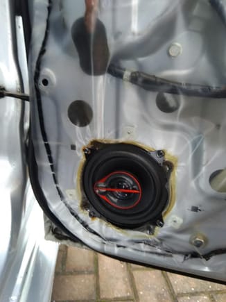 Rear speaker screwed direct to door skin