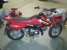 this is my xr 50 it has an aged look to it by that i mean i let it sit out side for about a month and the seat got all cracked but yeah its all stock