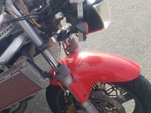 Aluminum bracket holding on the headlight