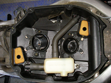 superhawk airbox internals, the longer runner goes on the rear.  Remove the runners to access the screws underneath.  Remove those screws as part of the airbox lower removal.  Note that hole in the right side (top of photo).  I don't know when, or even how this could have happened, but I bet it has something to do with the huge bump in mpg I got a couple years ago when I went from about 30mpg to a consistent 43mpg and never knew why.  We'll see...