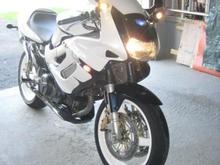 painted white with blue pearl, white powder coated wheels