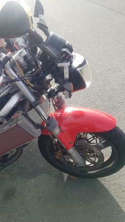 Aluminum bracket holding on the headlight