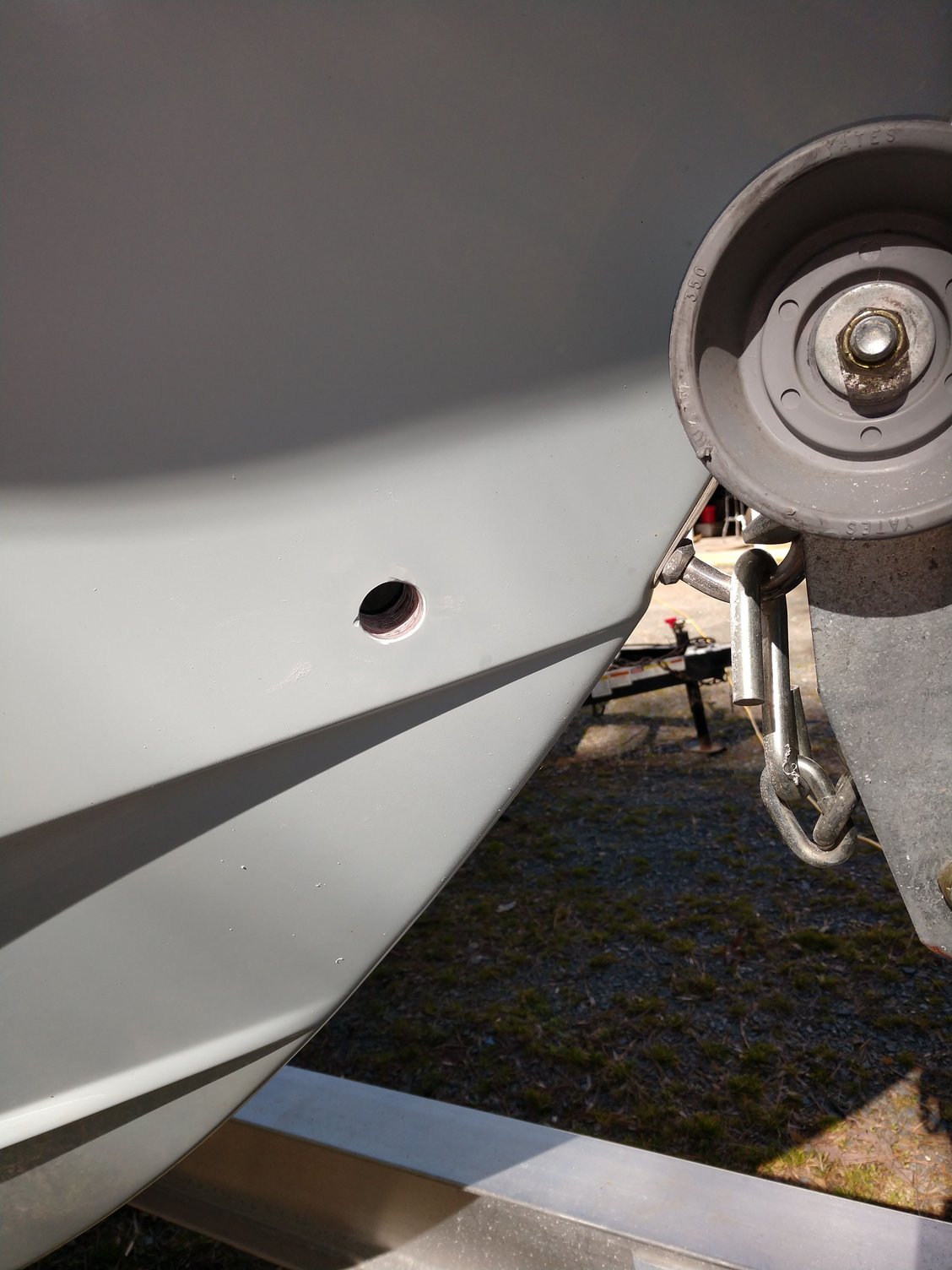 Scary hole to drill for anchor locker drain! Need a little glass help