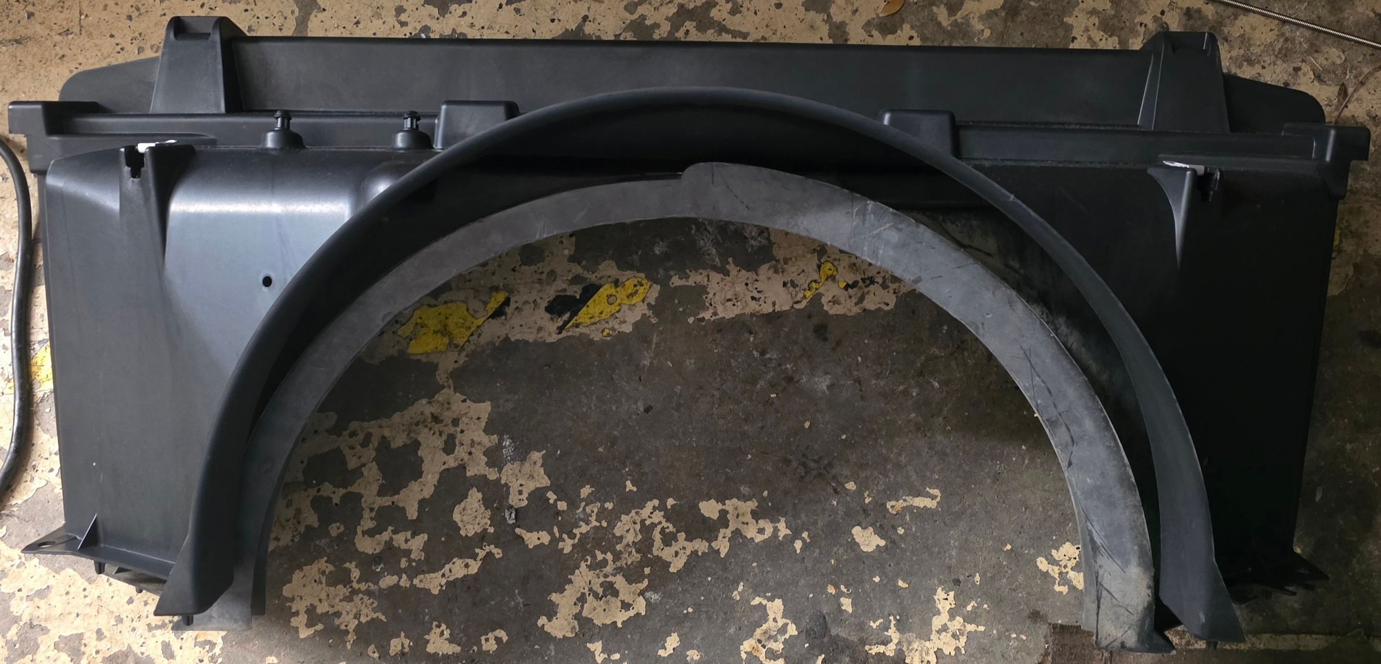L8T fan shrould with stock 1997 shroud sitting behind it.