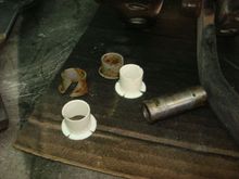 The new bushings are taller than the old but they fit just fine.