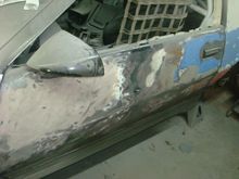 Drivers door slap full of bondo and had the red, blue and silver painted over the white.