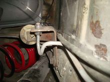 Bracket and steel brake line going to the front. It is new as well.