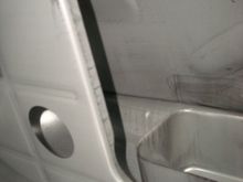 Left of the pump tray.