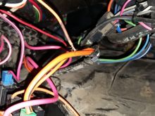 The end of the orange wire.