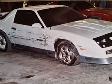 I wrecked this one, too.....and this car was damn near cherry before the accident, too. 1992 Z28, 80k miles, 305 TPI and a 5 speed.  I had a Stealth Ram 350 in the works for it, and it was going to be all white with pearl orange heritage stripes with orange emblems. I had 17" ROH wheels for it, too. Then this happened..

1984 Z28 in the background, 305 HO, auto, 80k miles