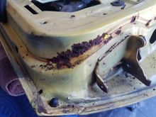 Odd spot for rust to form.  I think water got trapped behind the weatherstripping.