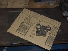 Glass plate for flatness, some 220-grit sandpaper.  All I need to "remachine" the injector cover.