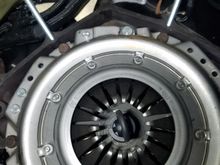 Shot of the clutch install.  I had initially thought the bellhousing would be attached to the transmission, then bolted to the block, so I created to guide posted to help with the install.  I then realized there was no way to install the clutch fork and throwout bearing using this method, so followed by mounting the bellhousing.