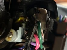 Right about the light gray piece with the button is where this piece will slip or “key” into. 