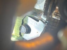 same bolt, other side.  The crack is in two places.  Parallel to the seat and then it twisted away from the rest of the bracket.  The piece still under the bult is severely bent.