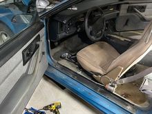 Interior is gray, the driver's seat is tan