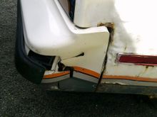 Rear bumper/ bumper cover are smashed in.