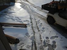 Dragging the second floor jack from the other shop in the snow.