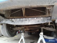 Here is the repaired air-dam. I made the repair panel out of the air-dam from a mid-'90s Camaro. I cut out a section of it, and bolted it onto the original air-dam base.
I chose to repair it instead of replacing it for a couple of reasons:
1) Cheaper
2) Any used air dam you find is probably going to be pretty beaten up after 25 years, and a new one from the dealer will be expensive (I should know, I bought one years back, but that was just because mine was completely gone, with nothing left to r