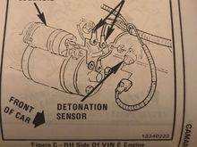 The knock sensor wire is in the harness with the starter wires above the starter