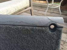 Front side of rear trim piece that had cracked and pieces broken off.  Used a wood burner to "weld" plastic back together.  Metal pieces were heated and embedded in the plastic to add rigidity.