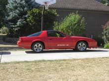 049, This is 1987 IROC Red w/ Grey interior, 5-spd, 305, nothing done, but oil change and AC charge. Has T-tops. Smells new, 2900 miles.