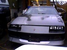 front of car with battery charger cable coming out oh yeah