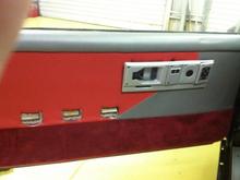 Door panel without the arm rests which are the same grey with red stitching.